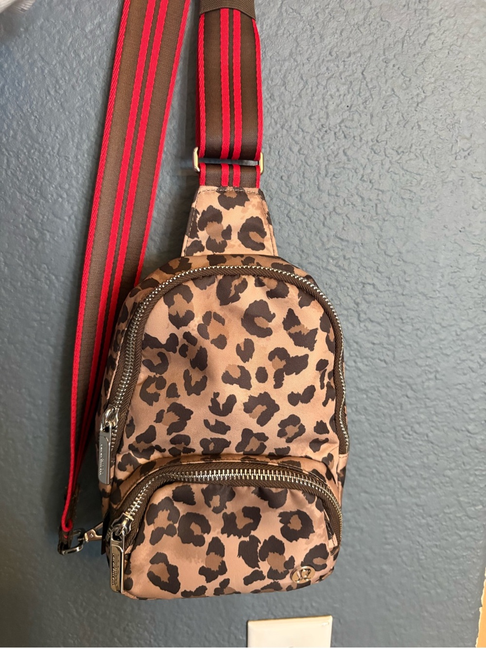 Lululemon Everywhere Sling BagLeopard Print Crossbody with Red-Striped Strap
